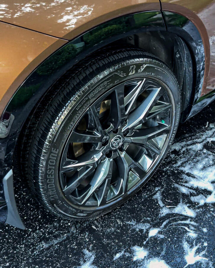 A completely restored and deep cleaned car wheel and tire well after a detailing service in Collegeville PA.